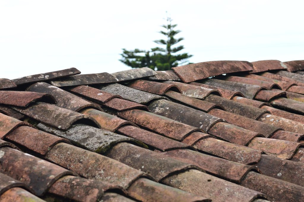 Worn-down old roof referring to one of 7 things that can fail a home inspection.